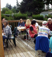 Here are some friends talking together and enjoying snacks before lunch is served