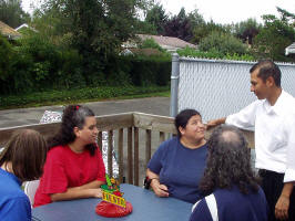 One the right is Elvis, our caterer from El Serape Mexican restaurant, is talking to Viola, Terry, Greg and Gloria.