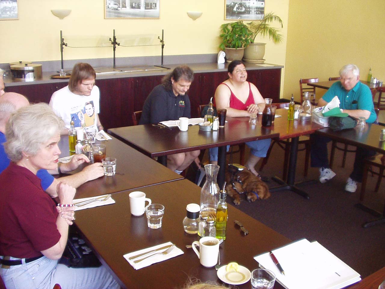 Photo #2 of members and guests sitting around tables.