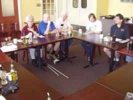 Photo #4 of members and guests sitting around tables